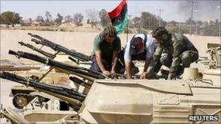 Libyan rebels with a captured tank in Zintan, 25 June 2011