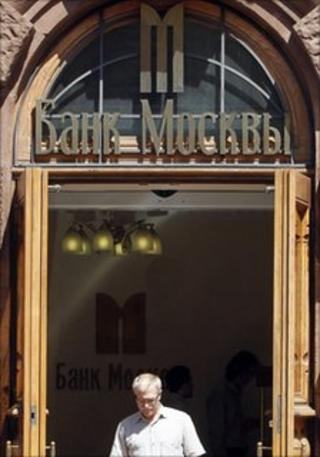 Man leaving branch of Bank of Moscow