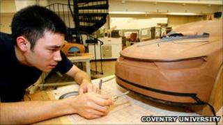 A student works on a car design project