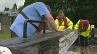 Volunteers painting a lock on the Leeds Liverpool canal near Bingley