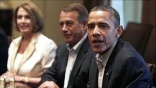 President Barack Obama, right, House Democratic Leader Nancy Pelosi, left, and House Speaker John Boehner, centre, meet with Congressional leadership in the Cabinet Room of the White House on 10 July
