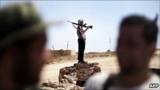 Libyan rebels gather at the front line in the Nafusa Mountains in Western Libya, on 10 July