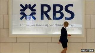 A worker in foyer of a Royal Bank of Scotland office in London