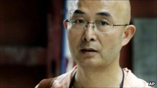 n this June 6, 2008 file photo, Chinese poet and novelist Liao Yiwu revisits the earthquake-damaged Gu Temple in Jiezi town of Sichuan province