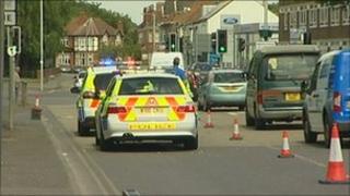 Police cars at the scene of the accident