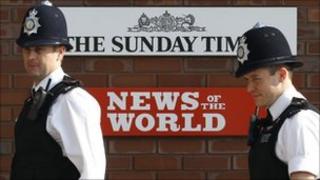 Police outside News International head quarters in the UK