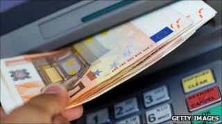Eurozone notes being withdrawn from an ATM