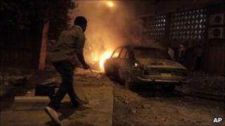 A car burns on a Cairo street, 23 July