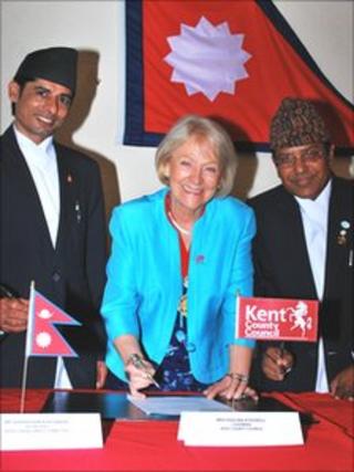 Pashupati Parajuli and Ghanshyam Khatiwada with KCC's chairman Paulina Stockell signing the agreement for Nepal to come to Kent to train