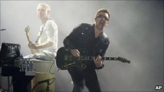 Bono, right, and Adam Clayton, from the rock group U2