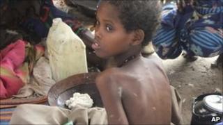 A child from southern Somalia takes food at a camp in Mogadishu, Somalia, Wednesday 3 August 2011