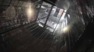 A shaft that transports equipment and debris out of the cavern