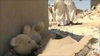 A teddy bear in the rubble
