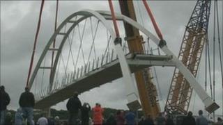 The new bridge is lifted into place