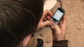 Generic image of a boy using a phone