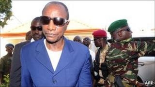 Guinea's President Alpha Conde arrives at his home in the capital, Conakry, after his victory in elections last year
