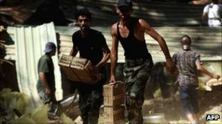 Libyan rebels seize ammunition buried underground by forces loyal to Muammar Gaddafi
