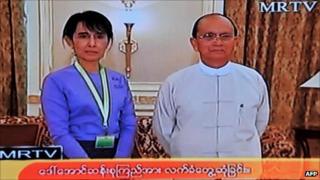 Grab from state-run MRTV shows Aung san Suu Kyi with Burmese President Thein Sein on 19 August 2011