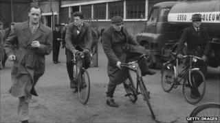 Workers leave a factory in 1956