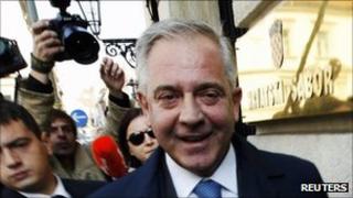 Former Croatian Prime Minister Ivo Sanader arrives to testify in Croatia's parliament in Zagreb, October 2010