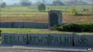 An inscription reading "They were flammable" and a Nazi swastika are seen on the Jewish war memorial in Jedwabne, Poland