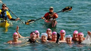 Ronan Keating (second left), Pamela Stephenson (fourth left) and Jenny Frost (fourth right) arrive at the Forty Foot harbour in Dublin as they celebrate finishing The Swim