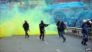 Ugandan anti-riot personnel fire teargas to disperse supporters of Ugandan opposition leader Kizza Besigye (May 2011)