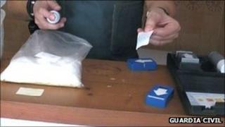 Guardia Civil officer with seized drugs