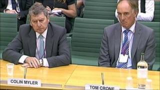 Former News of the World editor Colin Myler and lawyer Tom Crone are giving evidence to MPs