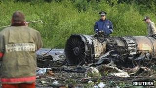 A policeman stands at the site of a plane crash outside Petrozavodsk