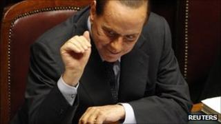 Italy's Prime Minister Silvio Berlusconi gestures during a debate in the upper house of parliament in Rome
