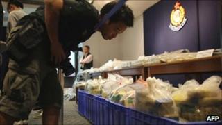 Photographer looks at cocaine haul on display at a Hong Kong police station on 18 September 2011