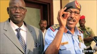 Sudanese Defence Minister Abdelrahim Mohamed Hussein (R) speaks during joint news conference with his southern counterpart John Kong Nyuon after signing an agreement in Khartoum