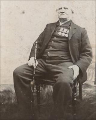 Pte Pearson as an older man wearing his medals