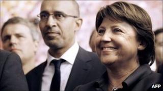 French Socialist politicians Martine Aubry (R) and Harlem Desir (L) listening to a Socialist victory speech in the Senate