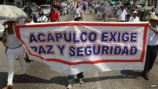 Teachers in Acapulco march on 14 September, with banner saying: Acapulco demands peace and security