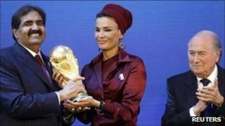 Qatar delegates celebrate after being awarded the 2022 World Cup hosting rights