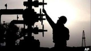 Worker checks pipes at PetroChina"s Tarim Oilfield in Xinjiang.