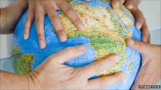 Globe with hands
