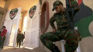 Guard at entrance to al-Judaida prison
