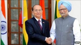 President of Myanmar U Thein Sein (L) shakes hands with Indian Prime Minister Manmohan Singh (R) in New Delhi on October 14, 2011