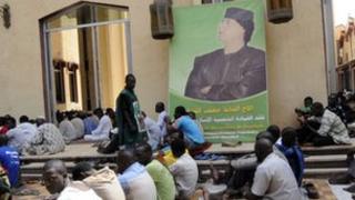 A portrait of Col Gaddafi at a mosque in Mali
