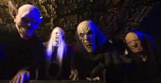Actors dressed as zombies