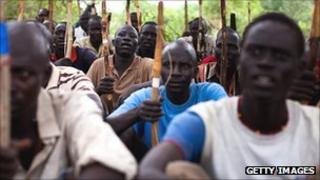 Recruits for the Sudan People's Liberation Army (SPLA) train in a secret camp in the Nuba mountains of South Kordofan 11 July 2011.
