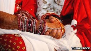 Wedding couple holding hands