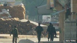 Syrian soldiers at an army checkpoint in Hula, near Homs, 4 November 2011