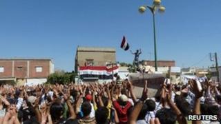 Demonstrators protesting against Syria's President Bashar al-Assad gather in Hula, near Homs, 4 November 2011