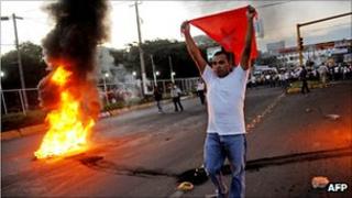 Nicaraguan opposition protesters beside a fire during protests in Managua against the election result
