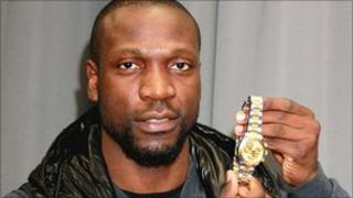 Ex-Arsenal footballer Lauren with his Rolex watch