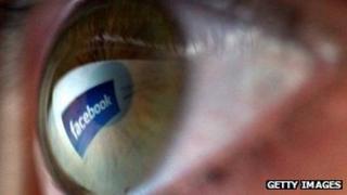 Facebook logo reflected in eye
